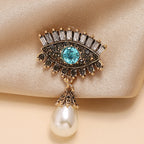 Pearl and diamond-encrusted alloy evil eye brooch