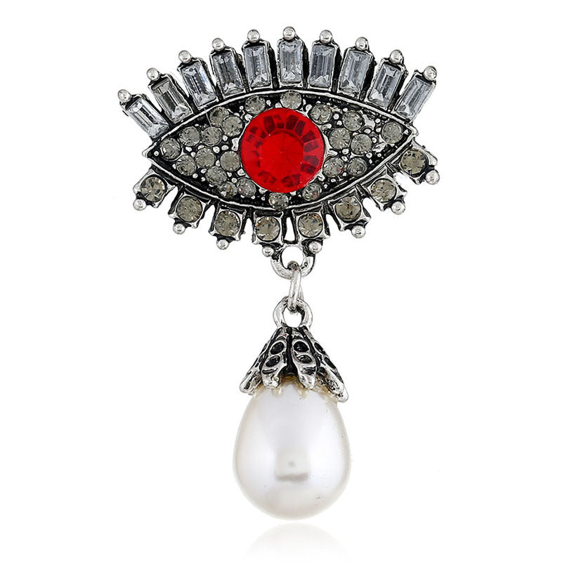 Pearl and diamond-encrusted alloy evil eye brooch