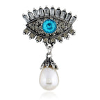 Pearl and diamond-encrusted alloy evil eye brooch