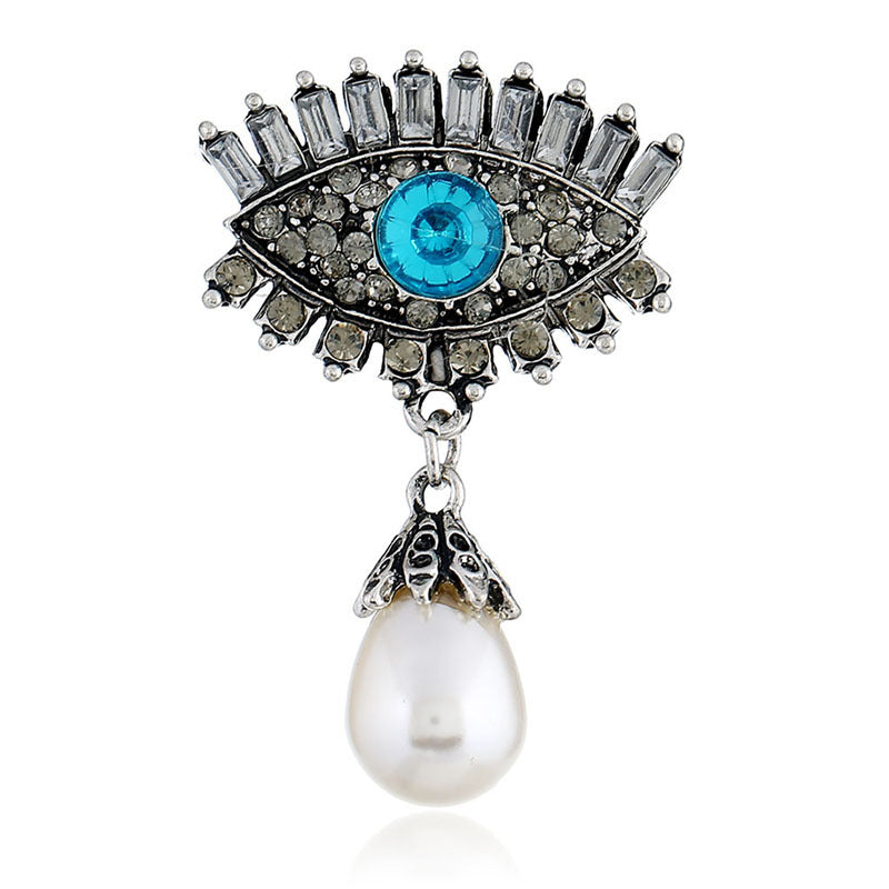 Pearl and diamond-encrusted alloy evil eye brooch
