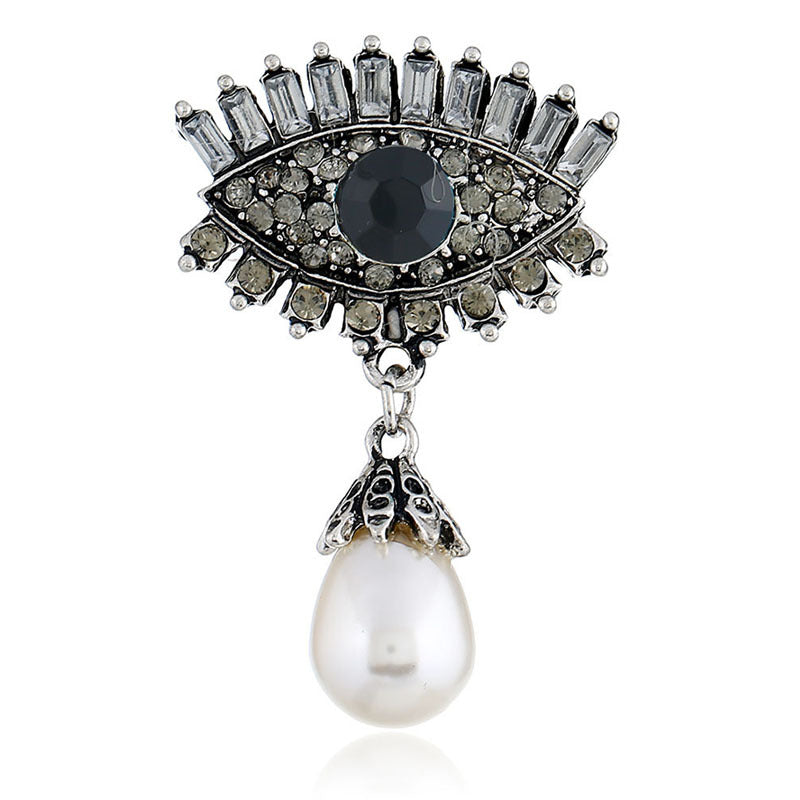 Pearl and diamond-encrusted alloy evil eye brooch