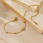 Diamond-encrusted gold-plated stainless steel evil eye bracelet link