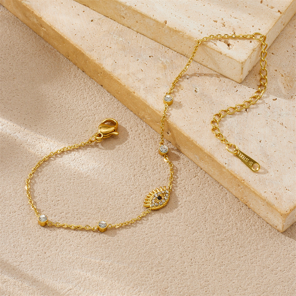 Diamond-encrusted gold-plated stainless steel evil eye bracelet link