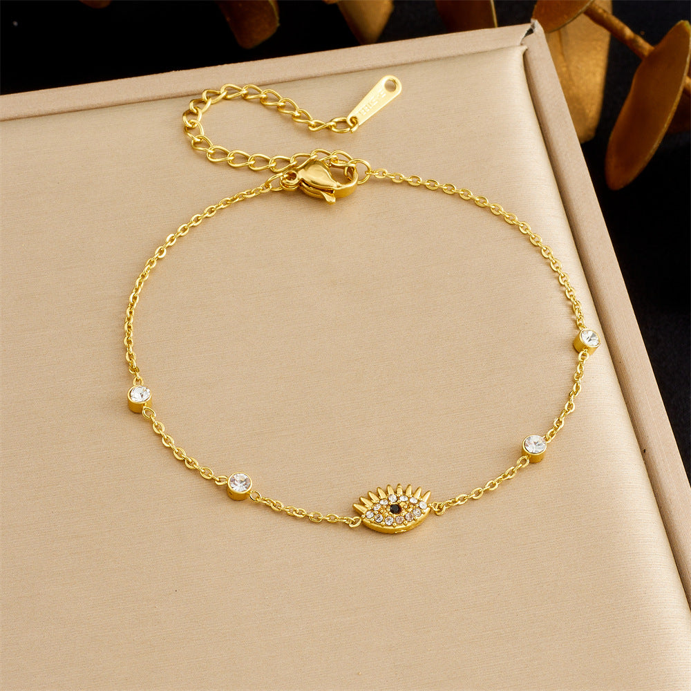 Diamond-encrusted gold-plated stainless steel evil eye bracelet link