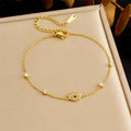 Diamond-encrusted gold-plated stainless steel evil eye bracelet link