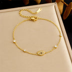 Diamond-encrusted gold-plated stainless steel evil eye bracelet link