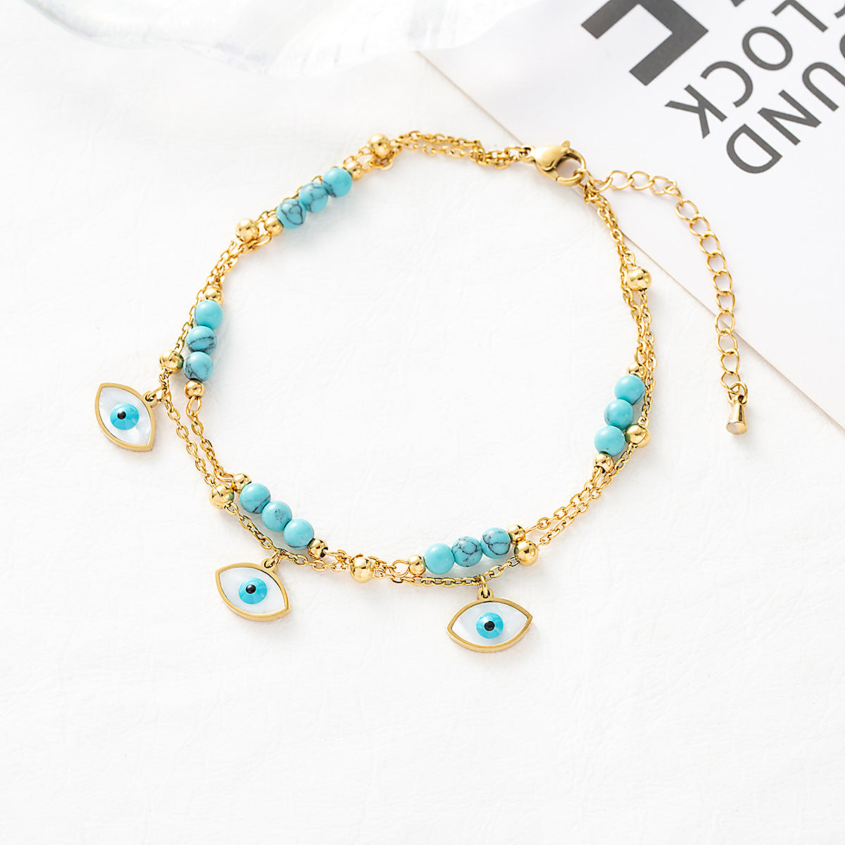 Titanium steel anklet with evil eye plating and multi-layered turquoise