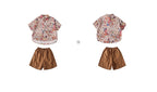 Boys' short-sleeved shirt with an all-over floral print