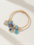 DIY Beaded Evil Eye Bracelet with Blue Rhinestones, Hearts, and Flowers