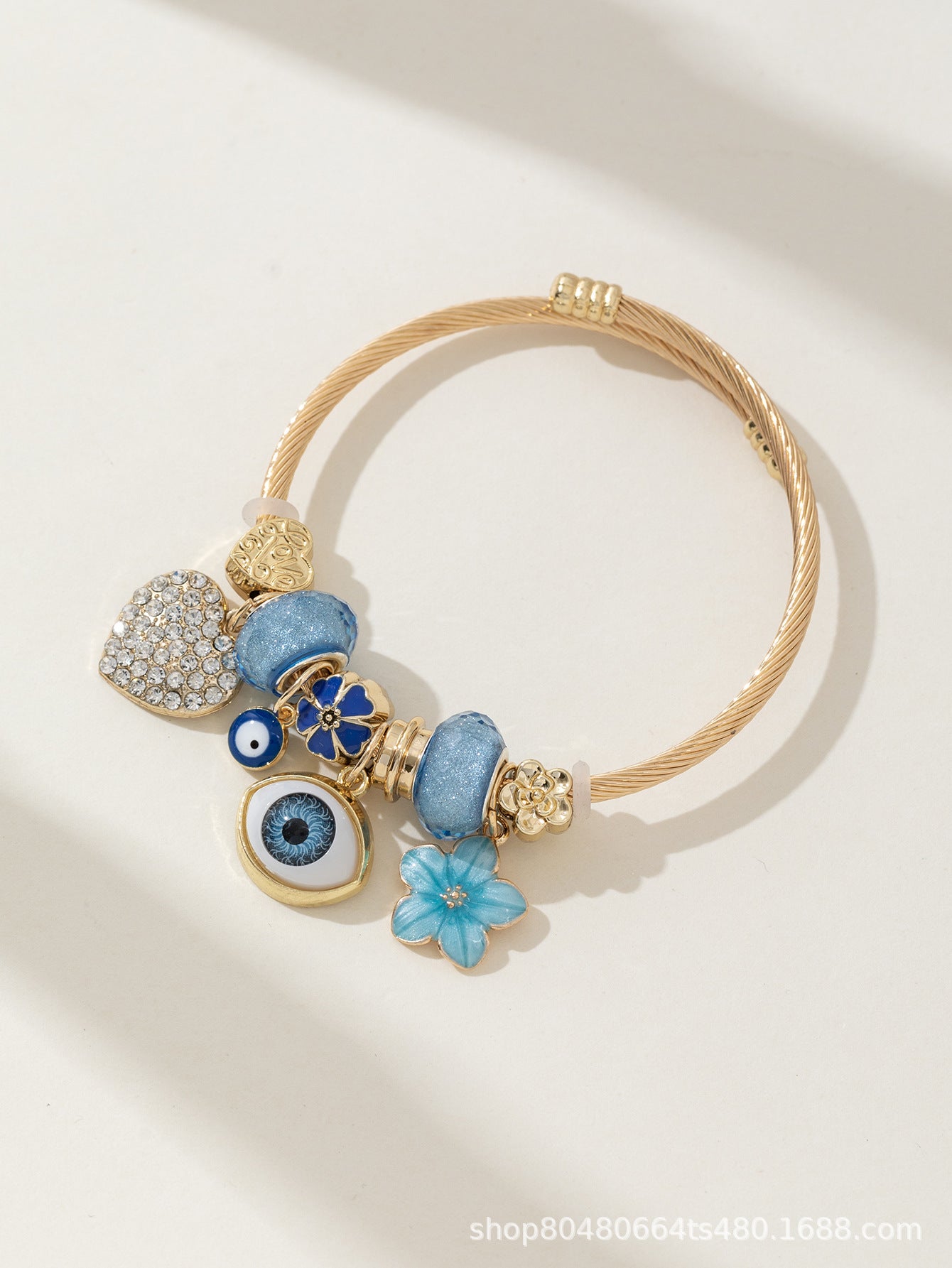 DIY Beaded Evil Eye Bracelet with Blue Rhinestones, Hearts, and Flowers
