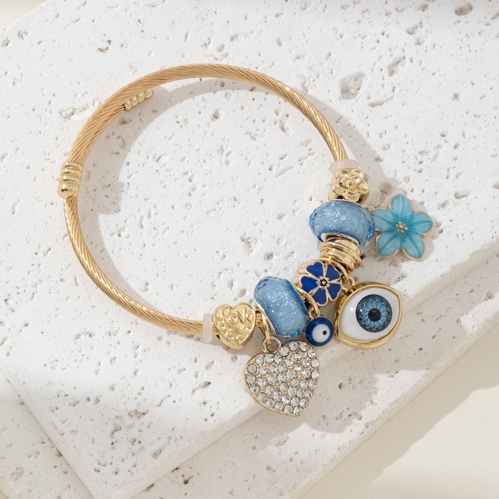 DIY Beaded Evil Eye Bracelet with Blue Rhinestones, Hearts, and Flowers