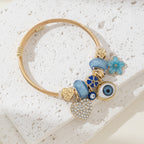 DIY Beaded Evil Eye Bracelet with Blue Rhinestones, Hearts, and Flowers
