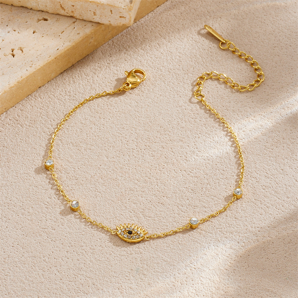 Diamond-encrusted gold-plated stainless steel evil eye bracelet link